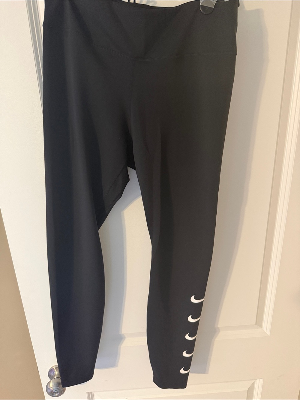 Nike women’s Black Leggings with White Crescent Logos